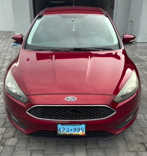 Red Ford Focus after detailing, with a glossy hood